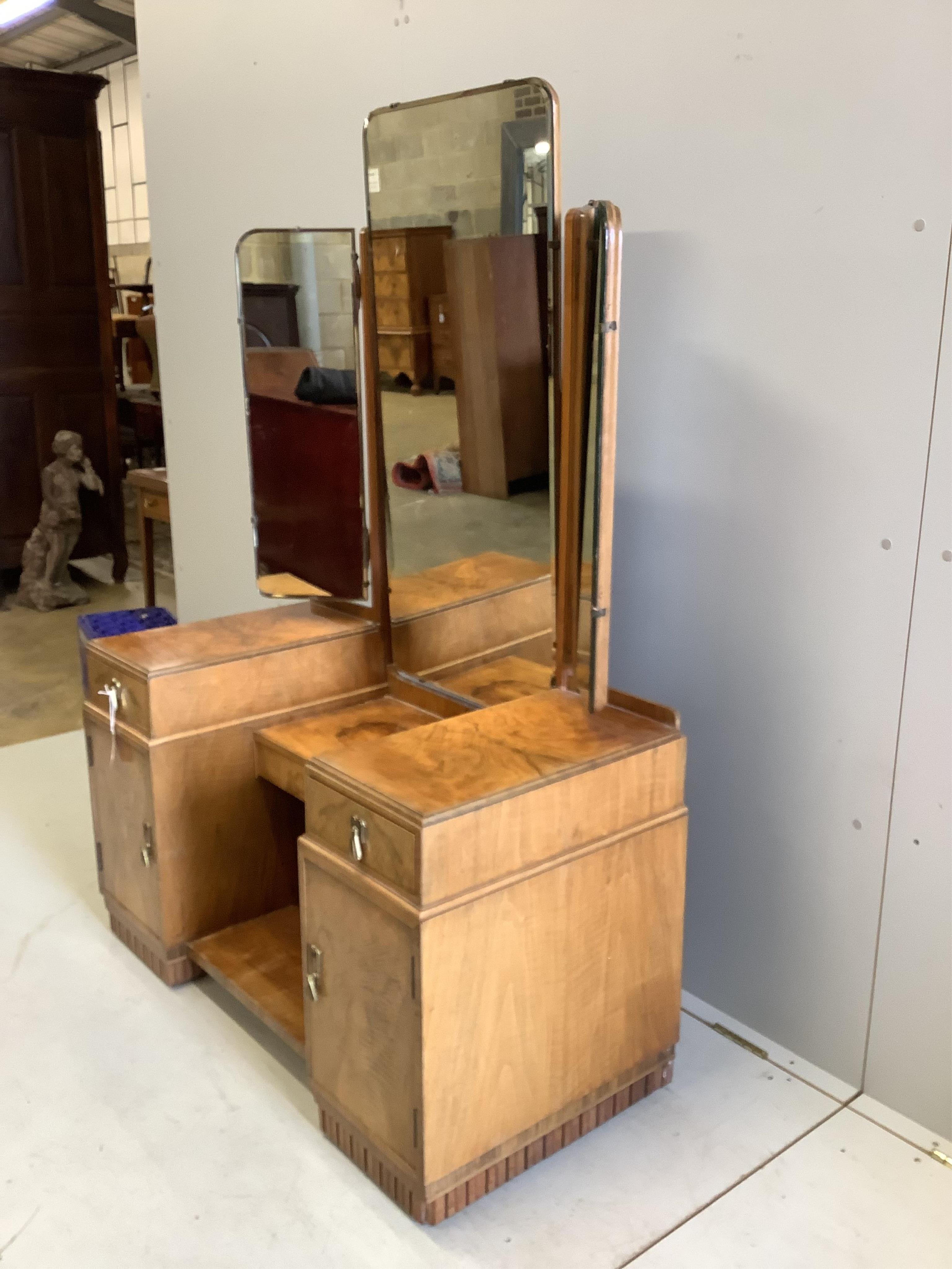 An Art Deco walnut dressing table, width 107cm, height 154cm. Condition - fair to good